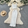 White Two Pieces Straps Boat Neck Knitted Tassels Midi Skirt Sets